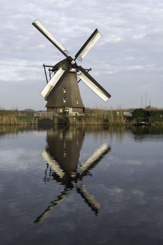 UNESCO World Heritage windmills in Kinderdijk in Holland europe, windmills at the water with reflection and twilight