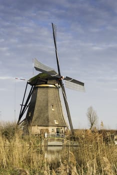 UNESCO World Heritage windmills in Kinderdijk in Holland europe, windmills at the water with reflection and twilight