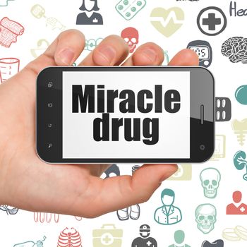 Healthcare concept: Hand Holding Smartphone with  black text Miracle Drug on display,  Hand Drawn Medicine Icons background, 3D rendering