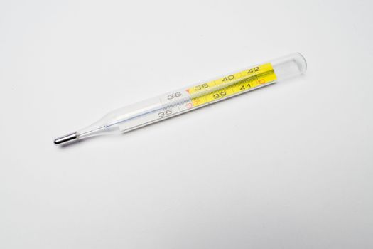 A fever thermometer on a white background