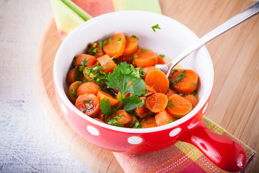 Baby carrots cooked with garlic, honey and parsley.