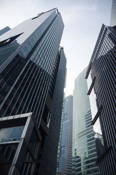 Modern transperent background perspective view to steel blue glass high rise building skyscrapers, industrial architecture