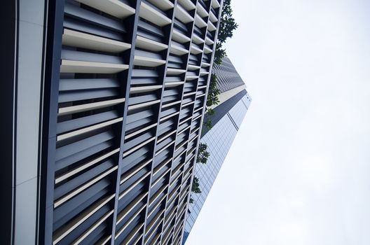 Modern transperent background perspective view to steel blue glass high rise building skyscrapers, industrial architecture