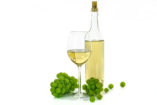 Bottle of white wine and a wineglass next to grapes isolated on white background