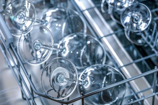 Shining glasses and dishes washed in the dishwasher