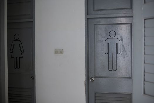 Men and women toilet signs on doors