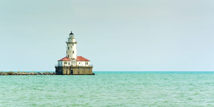 Lighthouse on a sunny day with blue sky.