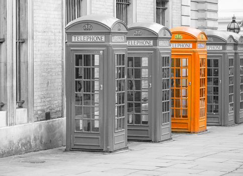 Five Red London Telephone boxes all in a row in the City