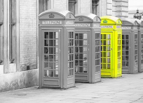 Five Red London Telephone boxes all in a row in the City