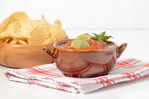 Fresh salsa and lime served with crispy tortilla chips.