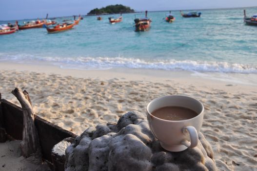 Cup of Coffee on the beach in the morning