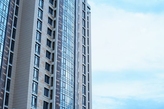 multi-storey office building skyscraper on skyline background