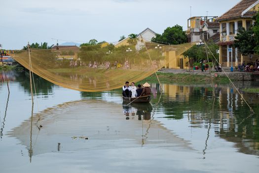 Hoai river in ancient Hoian town on January 26, 2015 in Hoian, Vietnam. Hoian is recognized as a World Heritage Site by UNESCO