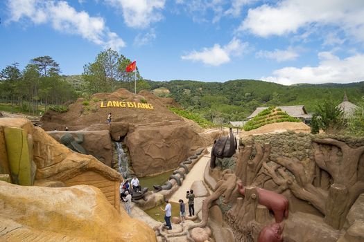 Amazing destination for Vietnam tourism, work of art know as sculpture tunnel from clay, crowd of traveller traveling architecture work in forest