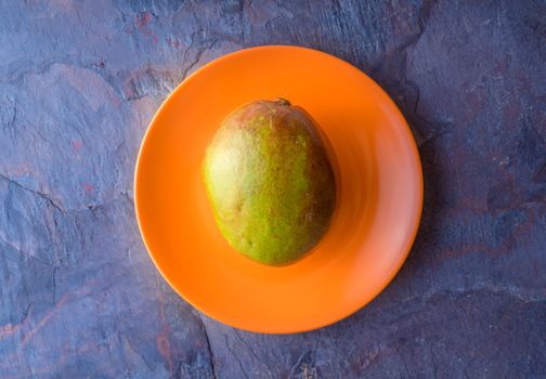 Mango is on the orange plate horizontal