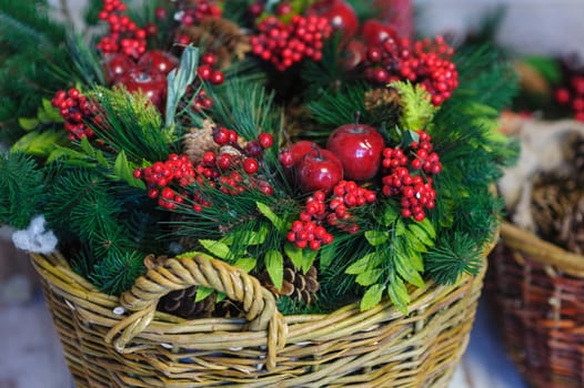 Christmas Decor basket with fir branches and red apples