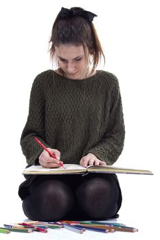 Young girl artist drawing pencils on white background