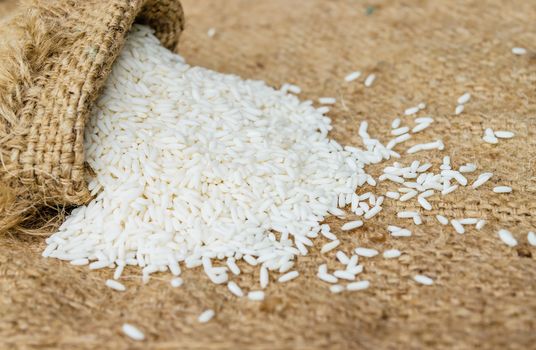 Glutinous rice in sack with hemp sacks background