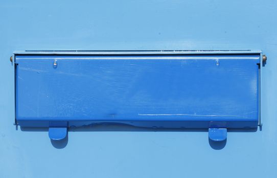 blue colored letterbox with mail slot