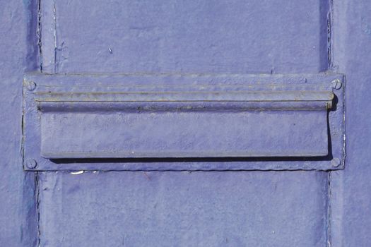 blue-purple letterbox with letter slot