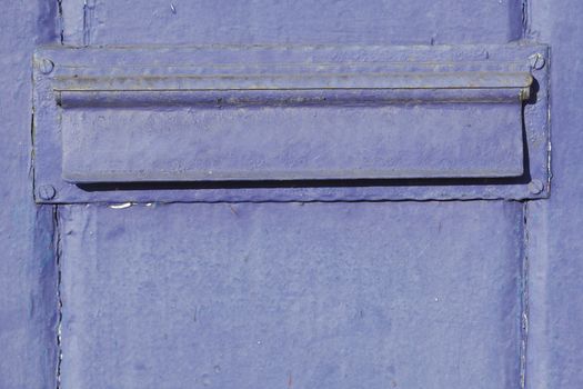 blue-purple letterbox with letter slot