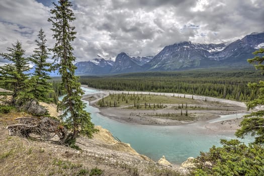 Athabasca River flowing through the Rocky Mountains - Jasper National Park, Alberta, Canada