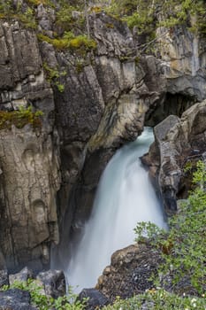 Waterfall in early summer in the Rocky Mountains - Banff National Park, Alberta, Canada