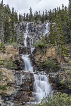 Waterfall cascading through the Rocky Mountains - Jasper National Park, Alberta, Canada