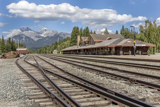 Railroad tracks run next to the historic Banff Train Station - Banff National Park, Canada