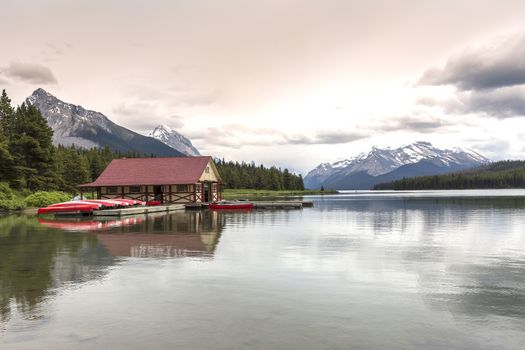 Boathouse on a Maligne Lake with Rocky Mountains in background - Jasper National Park, Alberta, Canada