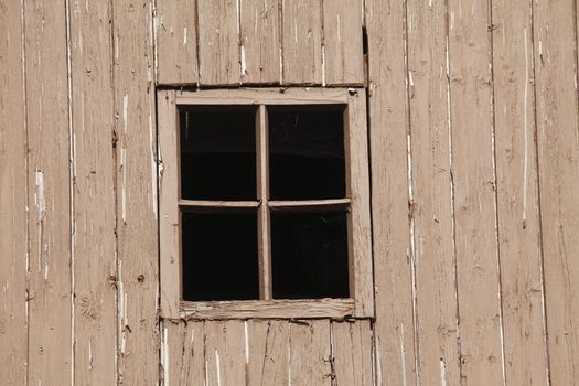 brown wooden house wall with wooden window