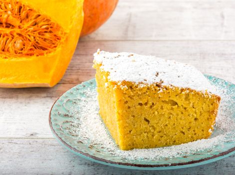 pumpkin pie, pumpkin and pumpkin piece  on a white wooden table