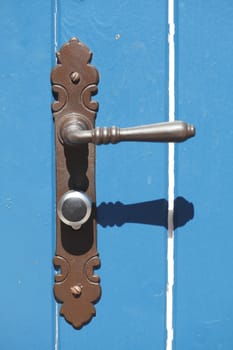 blue wooden door with metal lock