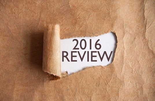 Torn piece of scroll revealing 2016 review underneath