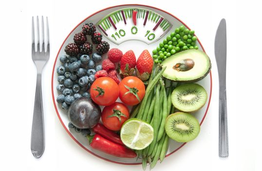 Bathroom weighing scales made of vegetables including chives, betroot and pepper