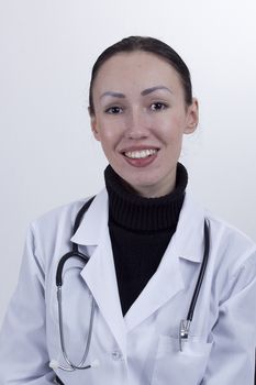 Young female doctor on a white background