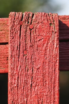 red wooden old garden fence