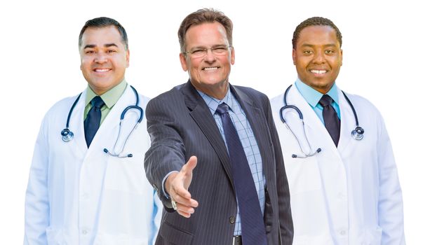Two Mixed Race Doctors Behind Businessman Reaching for a Hand Shake Isolated on White.