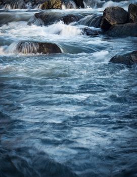 autumn background Wild small river cascade