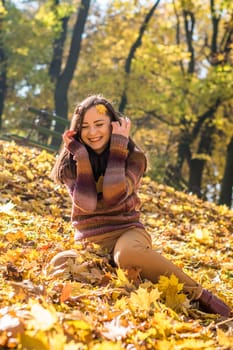 beautiful girl in autumn Park full of yellow leaves