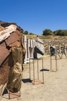 Messini Ancient City, Greece - August 16 2016: Metallic and wooden statues in the ancient Greek city of Messinia at Peloponnese, Greece