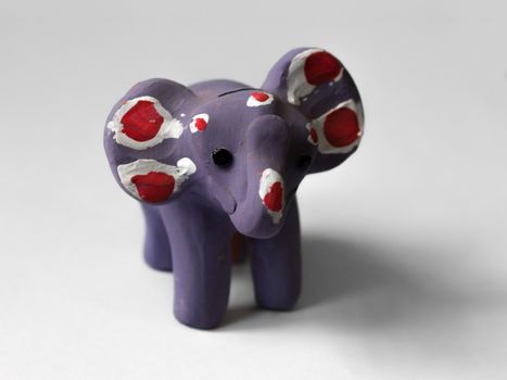 COLOR PHOTO OF PURPLE ELEPHANT TOY