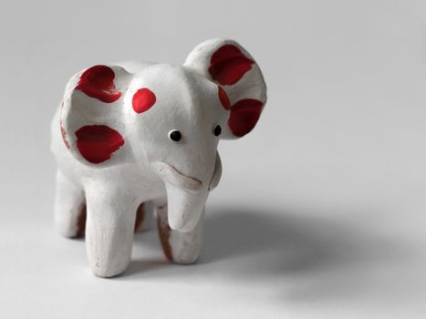 COLOR PHOTO OF WHITE ELEPHANT TOY