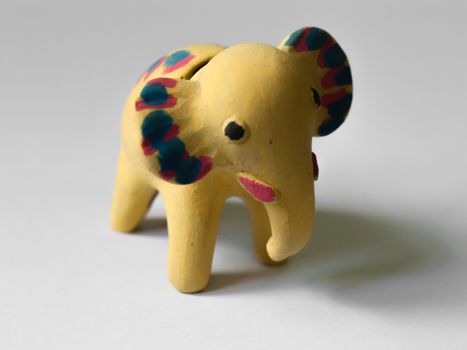 COLOR PHOTO OF YELLOW ELEPHANT TOY