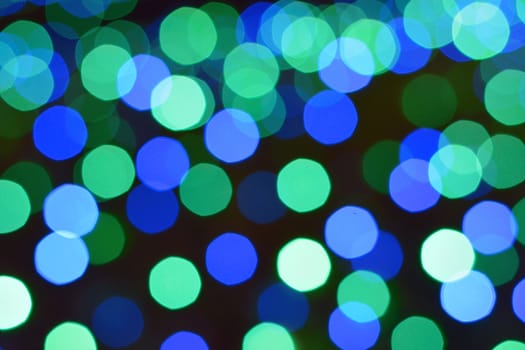 Background Winter illumination colorful blue LED blurred lights in horizontal frame