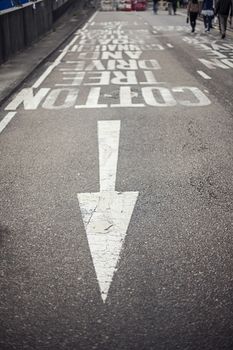 Road markings with arrow on asphalt. Travel and transportation concepts