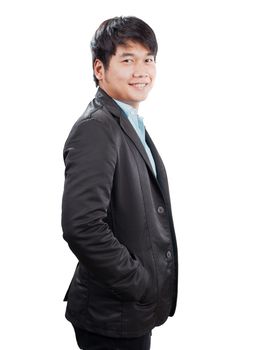portrait side view of young asian man with western suit standing and smiling to camera isolated white background
