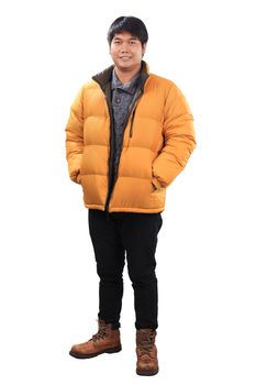 portrait of young asian man wearing yellow winter jacket and black jeans leather shoes standing with smiling face isolated white background