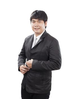 young business man with western suit standing in front of white background smiling to camera