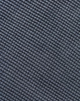 the abstract background texture of a knitted fabric